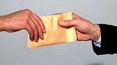 28574882-man-passing-a-bribe-to-another-in-slow-motion